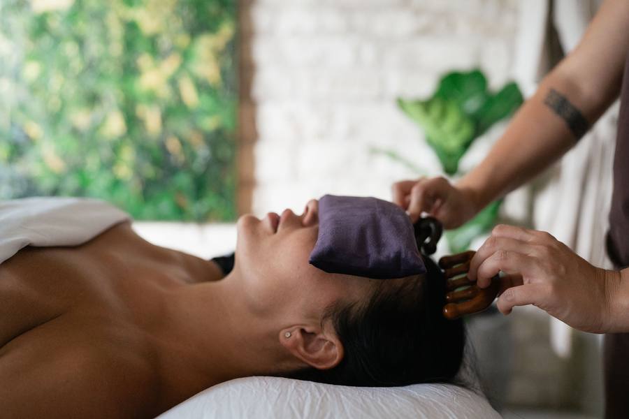 Head massage with lavender eye pillow